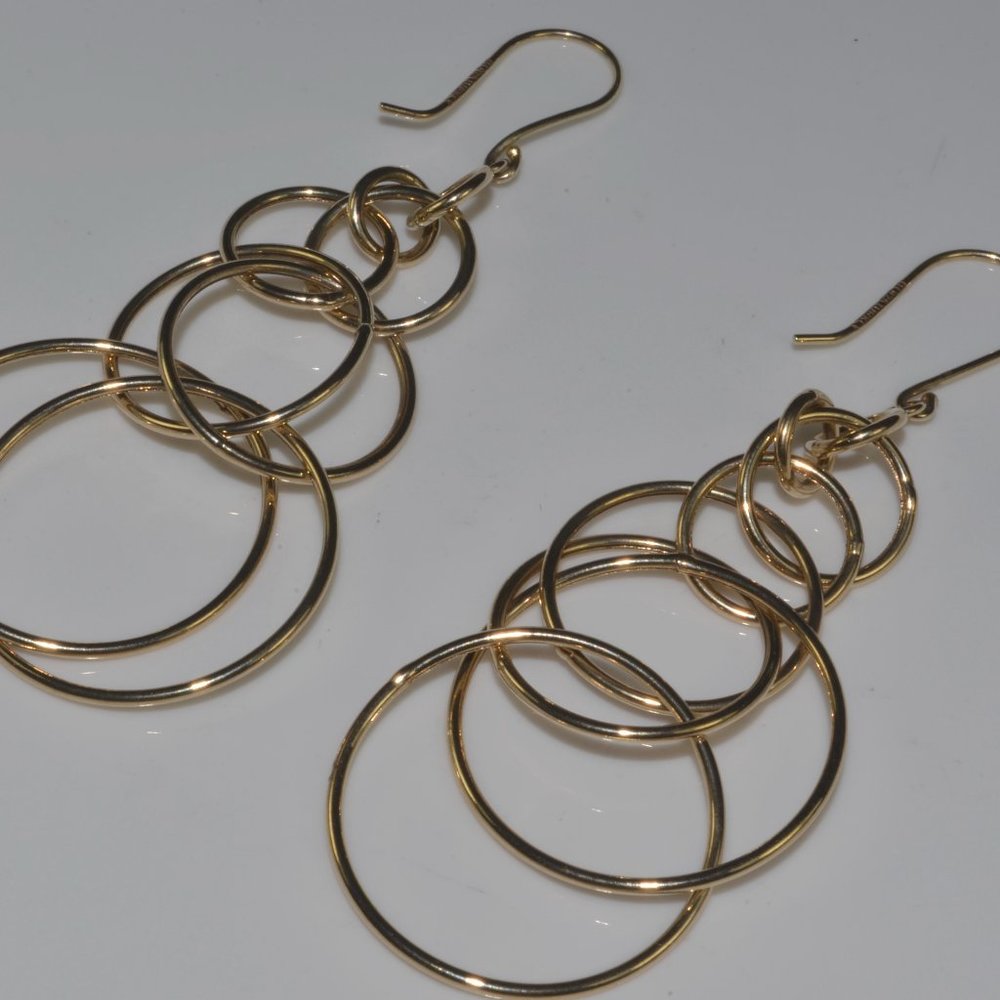 2 pairs of sterling silver earrings. gold tone